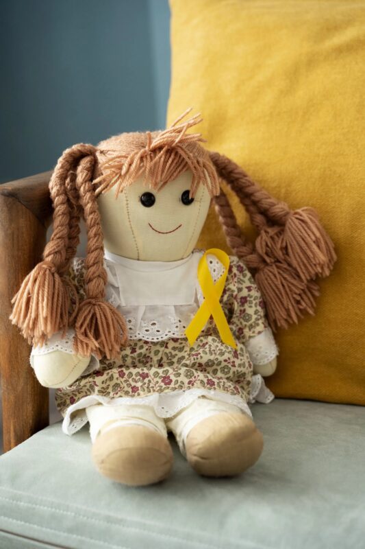 A homeless man was rummaging through a garbage container when he suddenly noticed an old doll