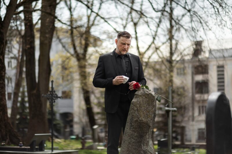 Through the crematorium glass, he noticed his pregnant wife's belly trembling slightly